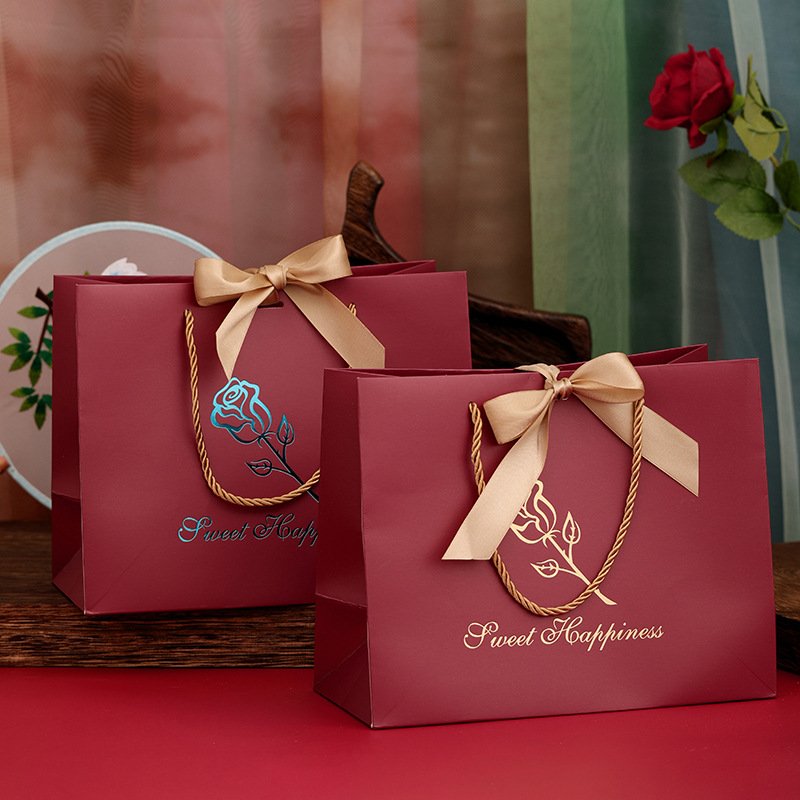 Retail packaging handles ribbons and concealed magnetic closures